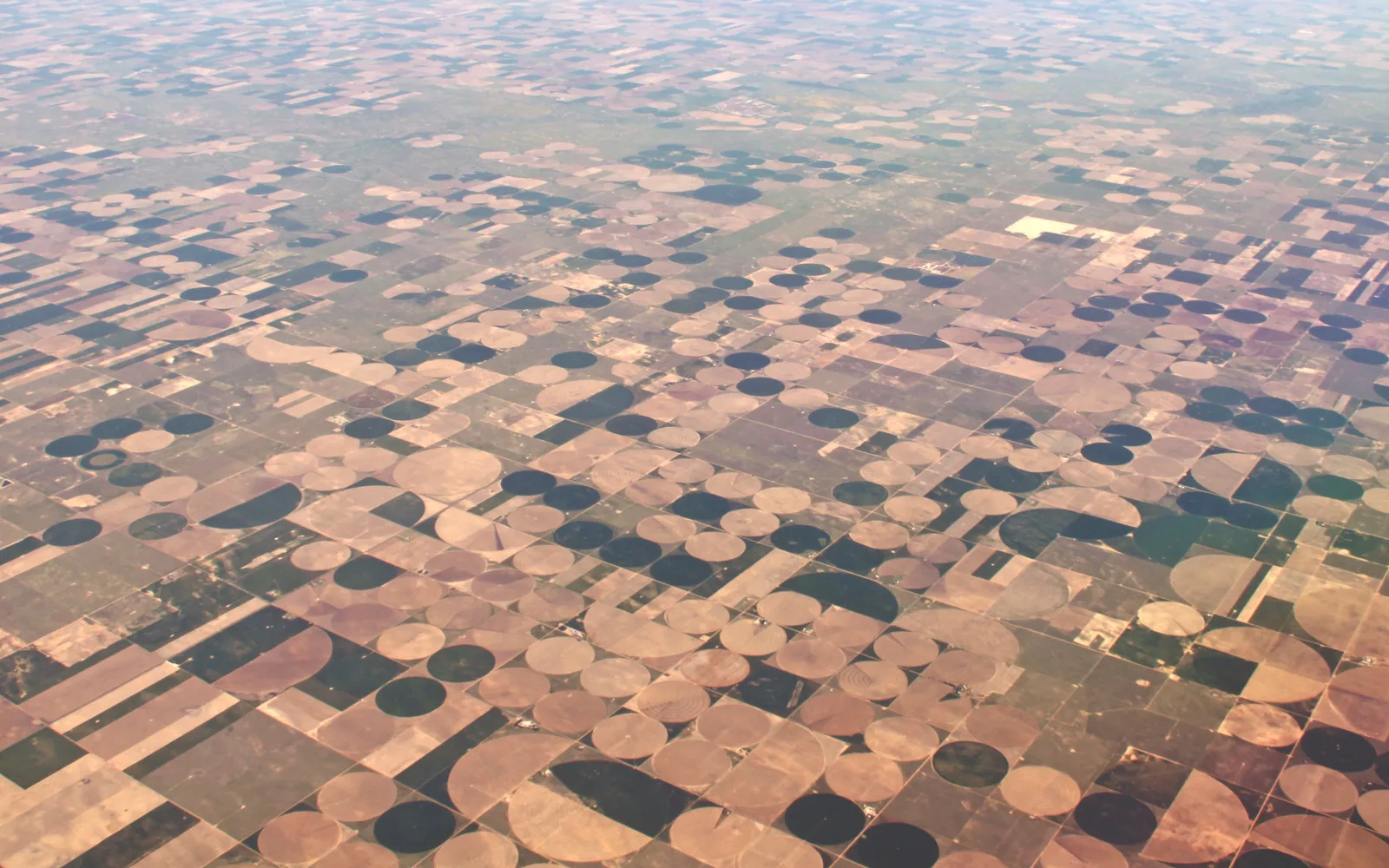 Aerial view of center pivot irrigation systems in agricultural farmland
